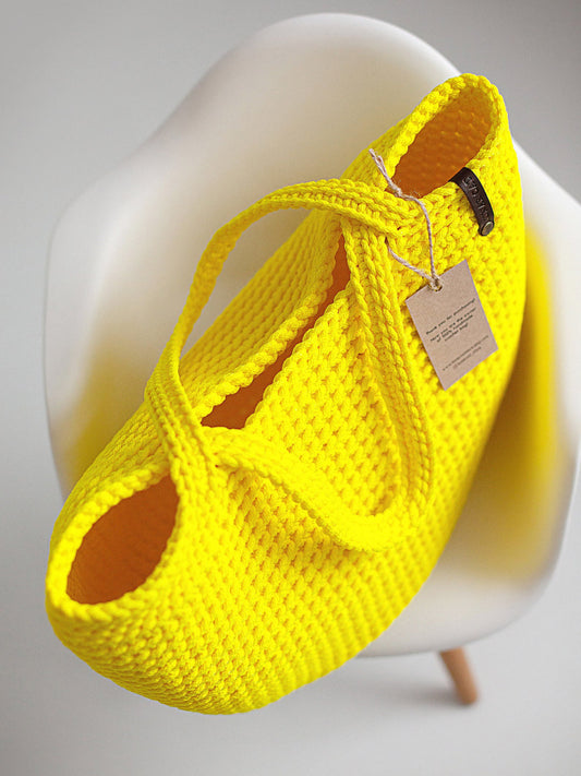 Large crochet tote bag in a neutral color, front view