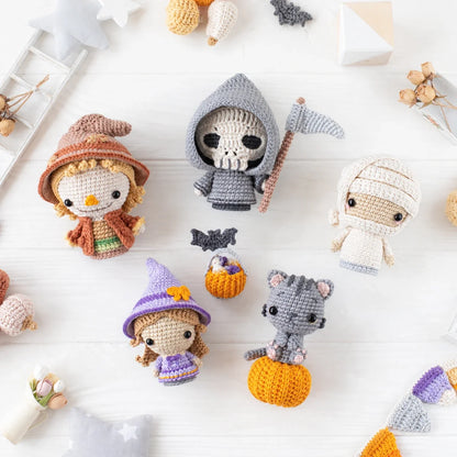 Crocheted little witch amigurumi figure