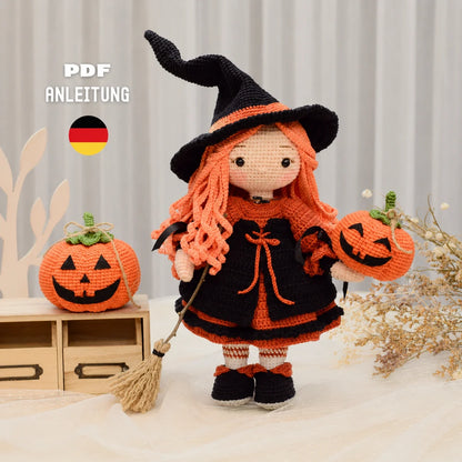Beatrix the crocheted Halloween witch amigurumi with black hat and orange hair