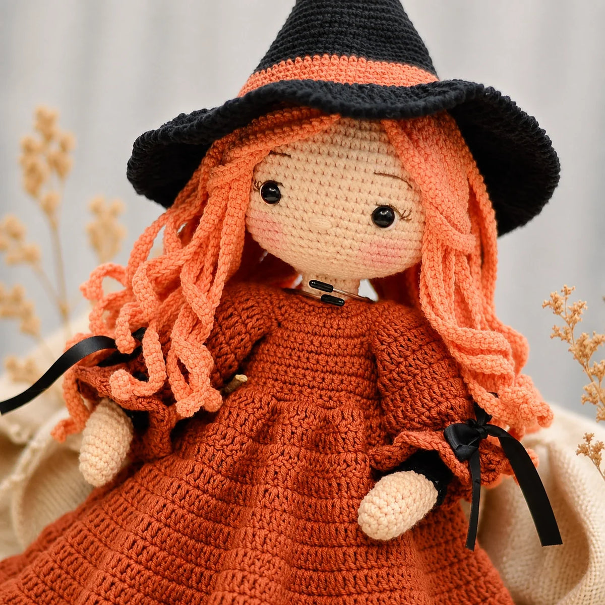 Close-up of Beatrix's crocheted witch hat and face