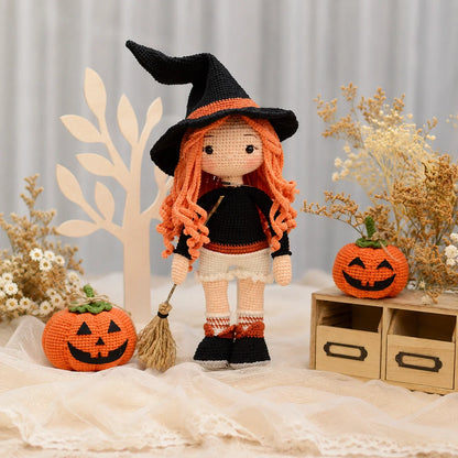 Amigurumi witch in a festive Halloween dress