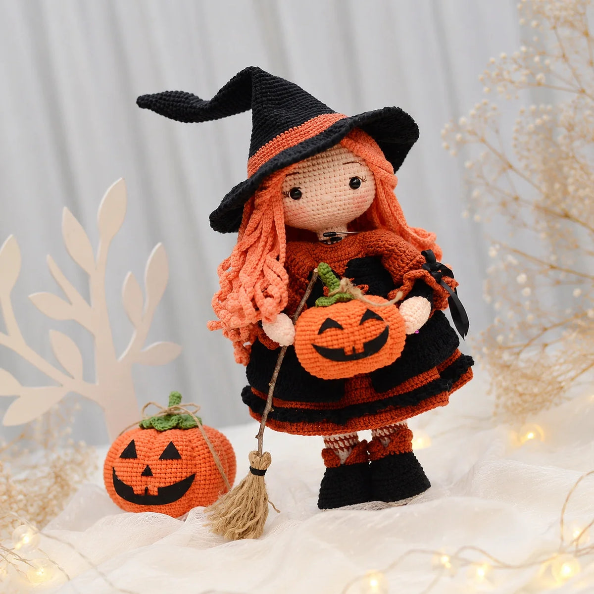 Beatrix amigurumi witch on a fall-themed background