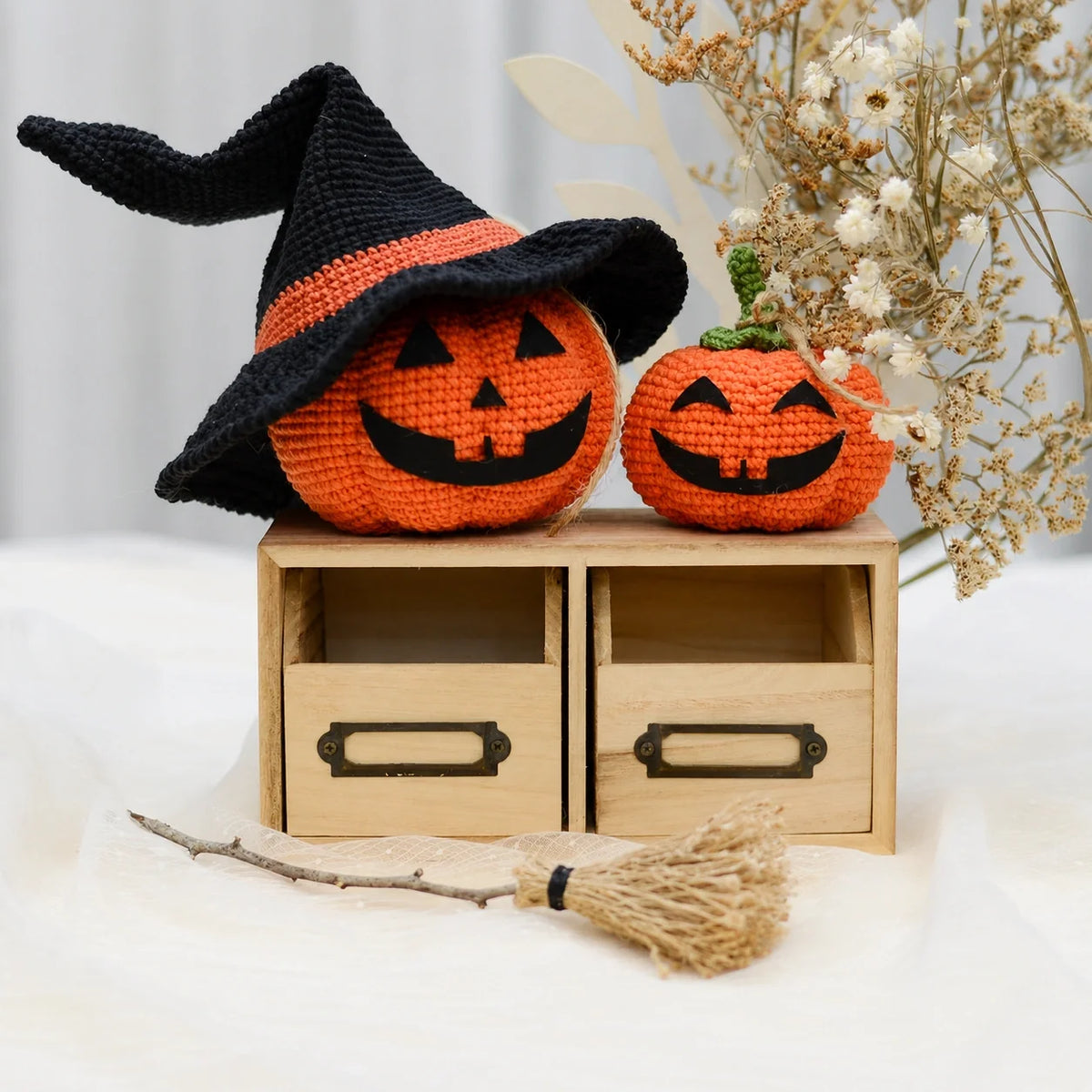 Crochet pumpkins styled with candles for Halloween
