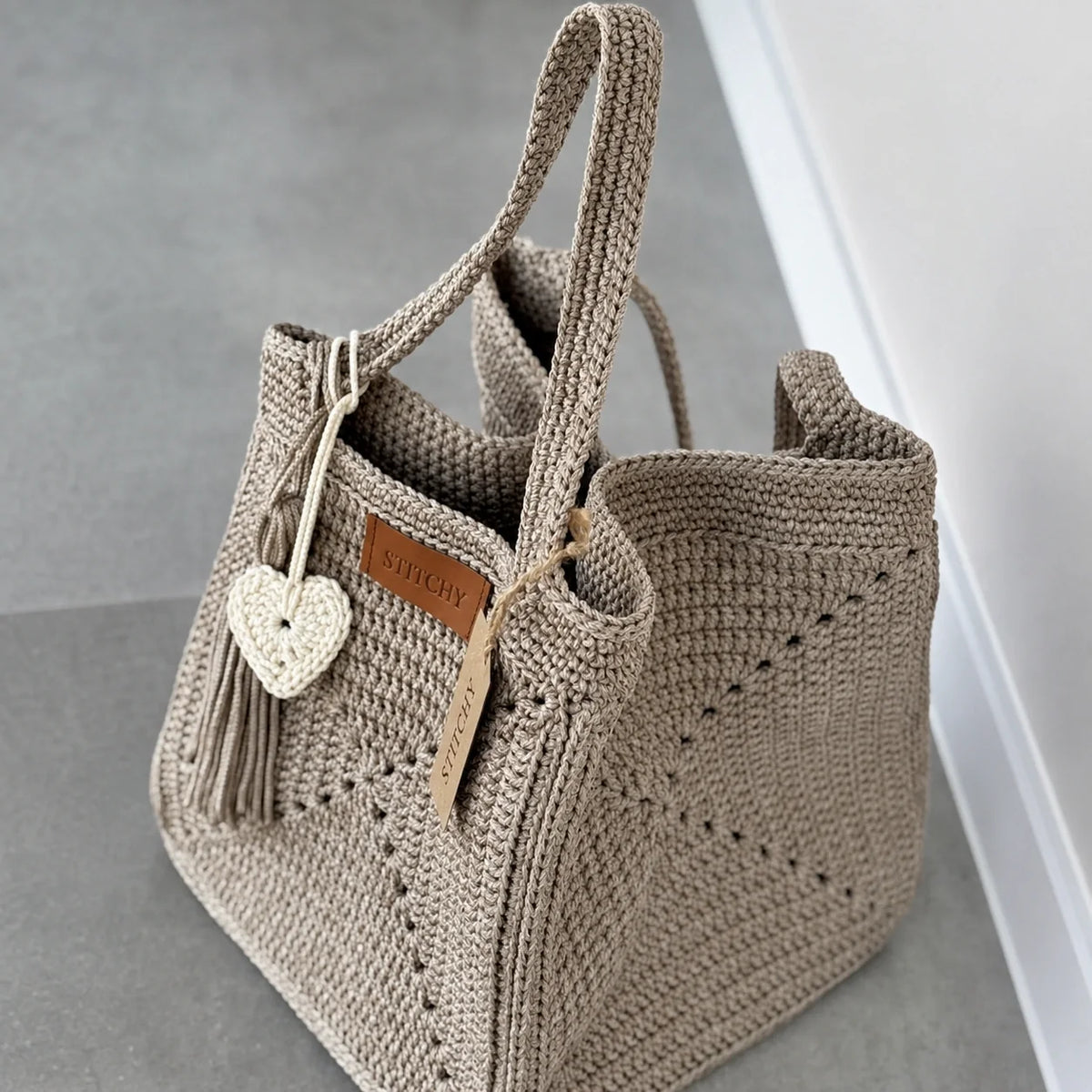 Side view of the structured cord crochet tote bag
