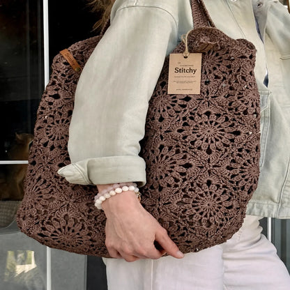 Raffia crochet bag with granny square pattern, side view