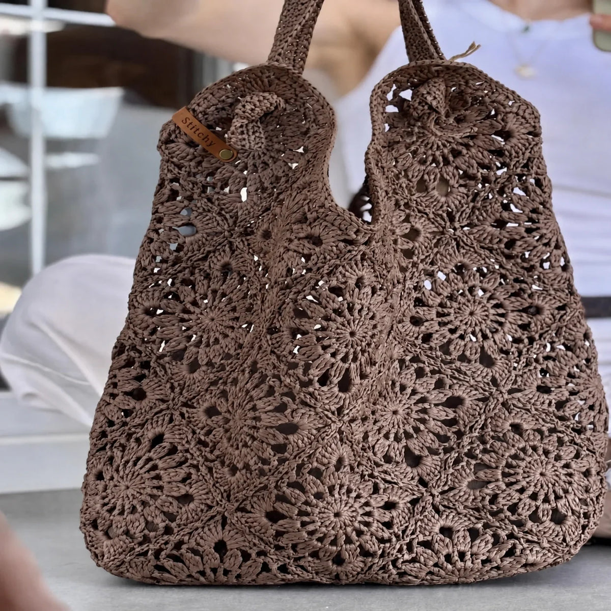 Handmade granny square tote bag in natural raffia tones