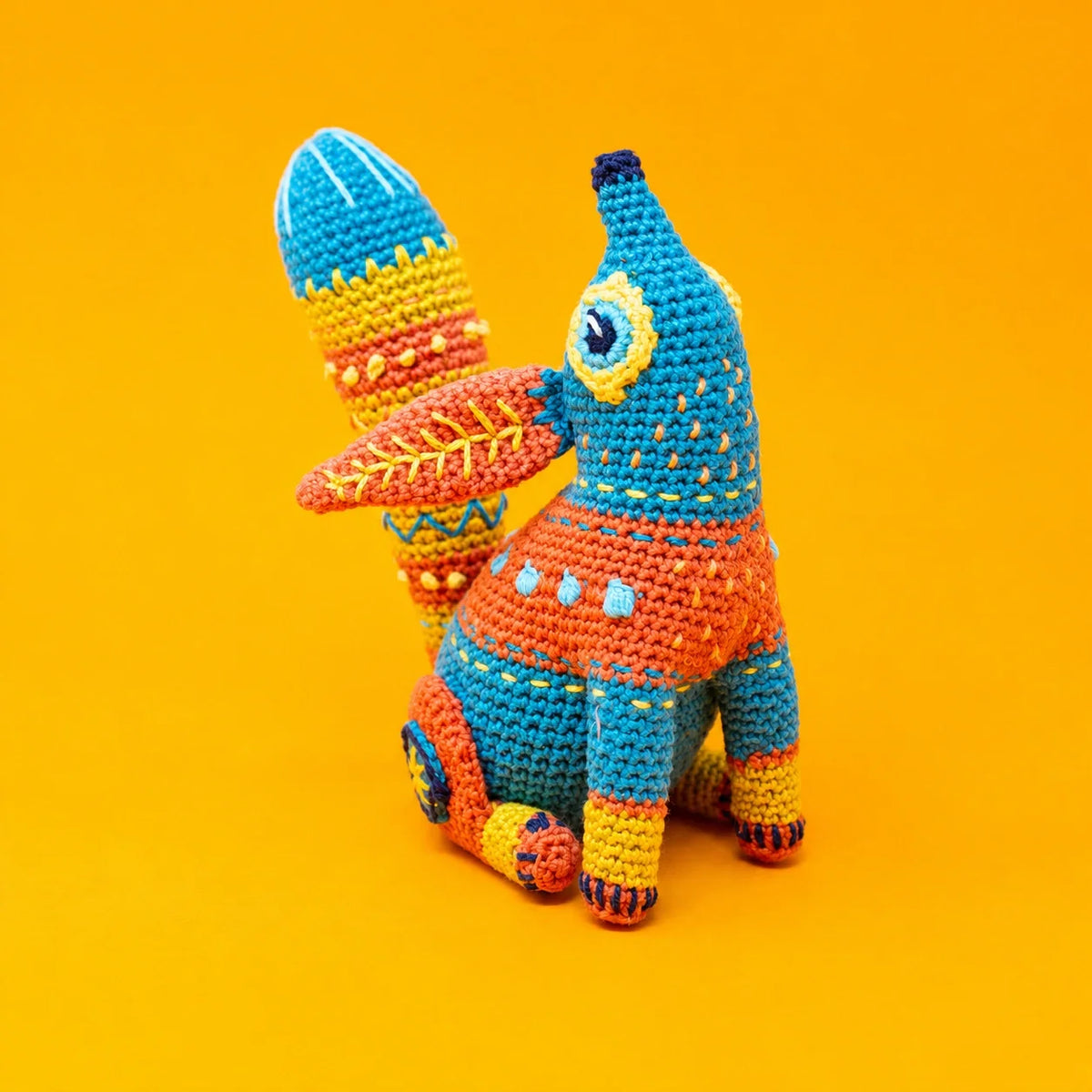 Alebrije fox amigurumi showing bright color accents and playful tail