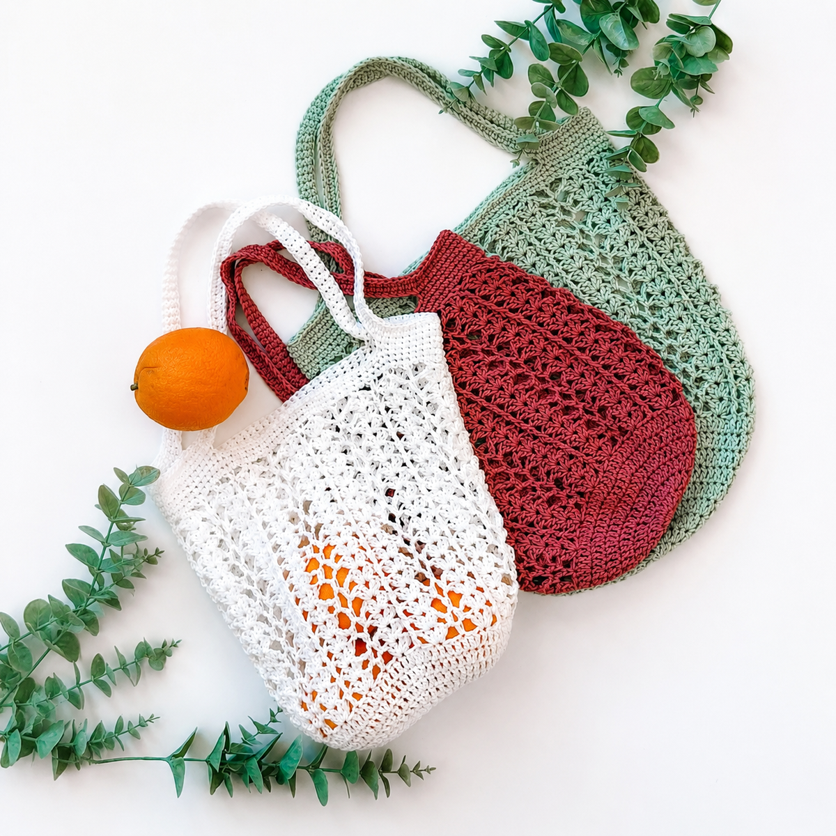 Crochet market bag holding fruit and vegetables