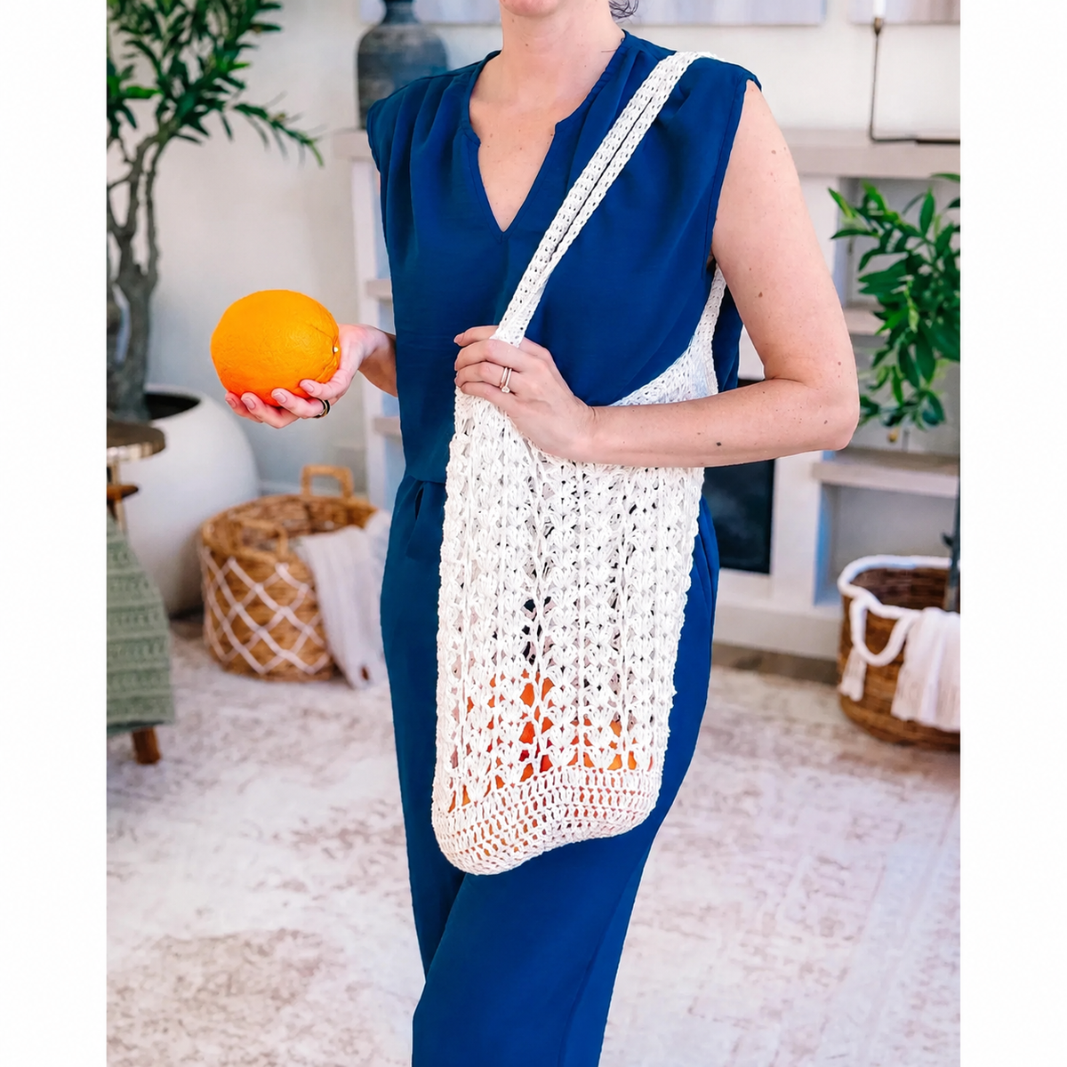 Lightweight crocheted mesh bag on the shoulder