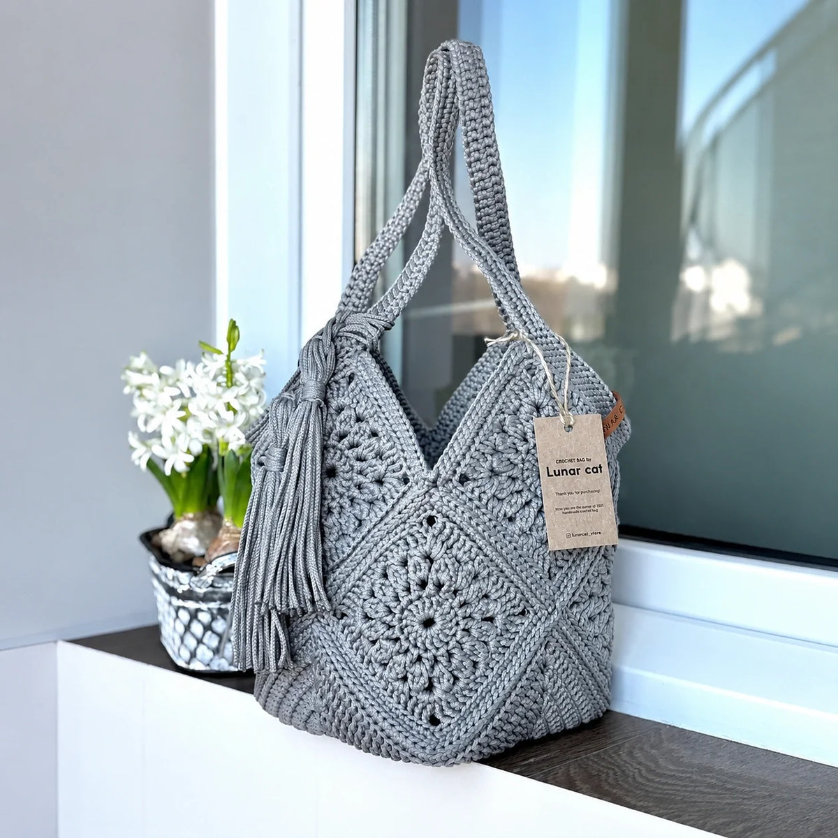 Crocheted market bag styled outdoors
