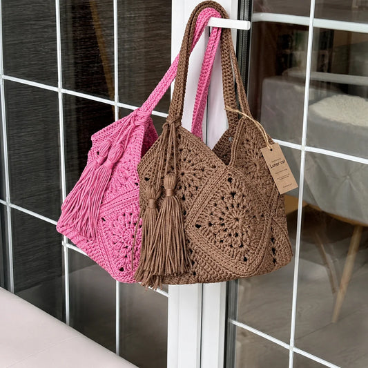 Crocheted granny square market bag with tassel charm, front view
