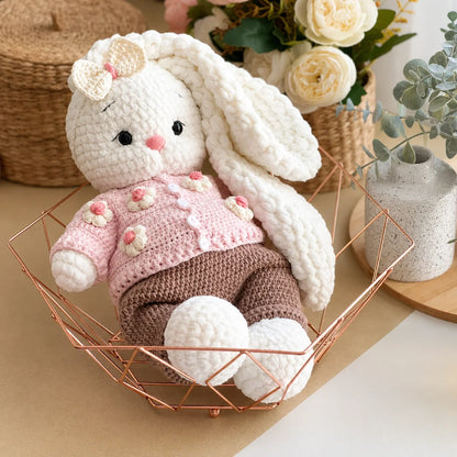 Bella the Bunny crochet doll held in hands to show size