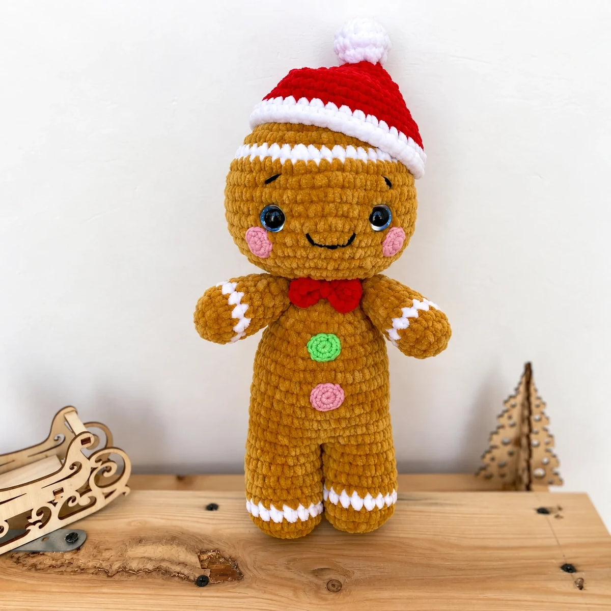 Christmas amigurumi crochet figures arranged on a festive table