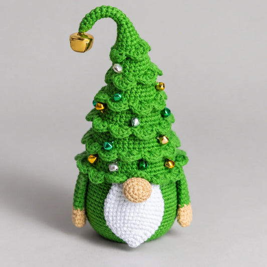 Christmas tree gnome amigurumi displayed on a festive shelf