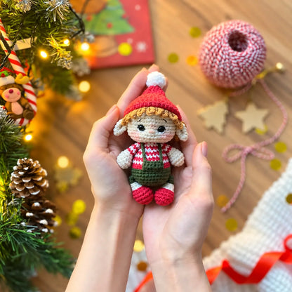 Handmade crochet elf figure among Christmas decorations