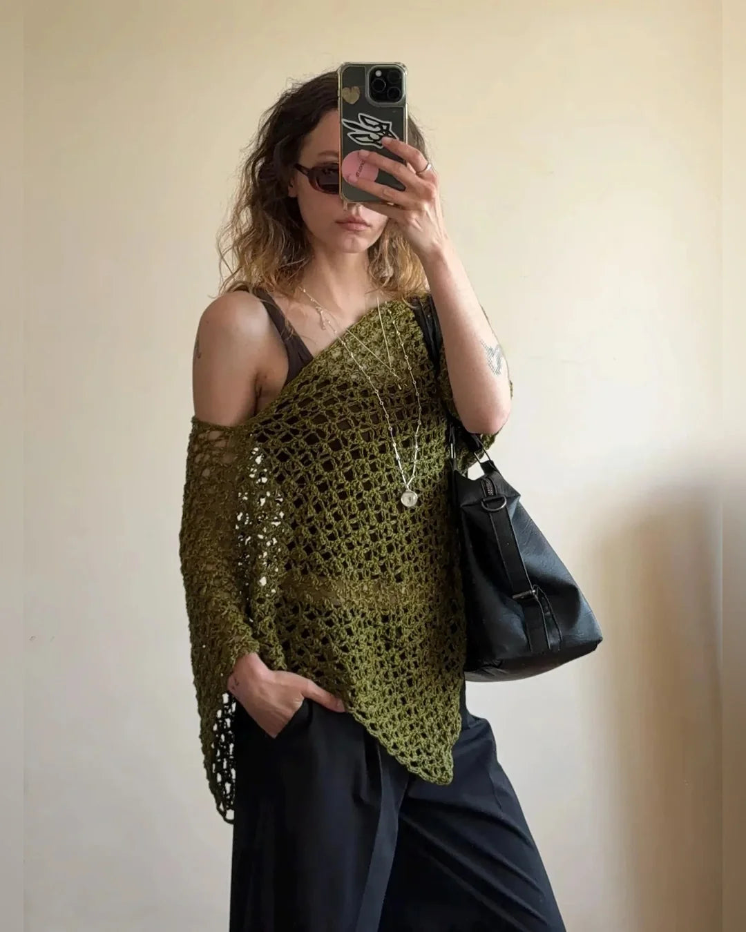 Model wearing the NOA poncho top centered like a classic poncho