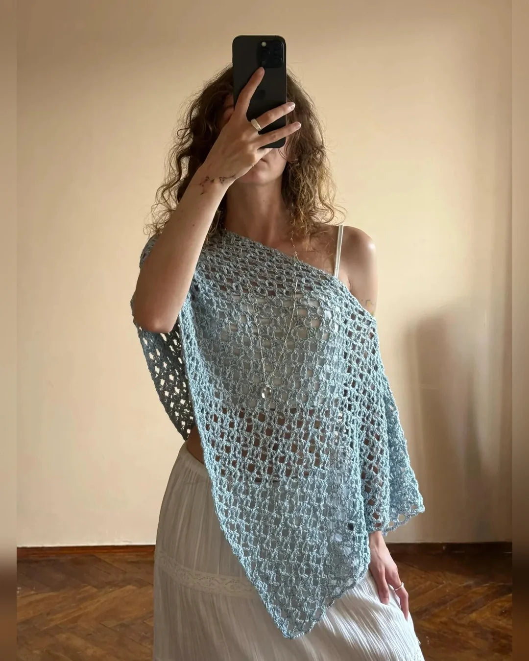 NOA poncho top showing the soft drape and single seam construction