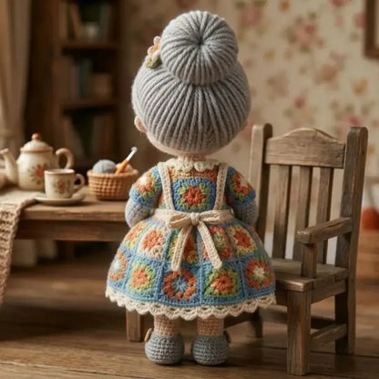 Crocheted grandma doll showing her cardigan and skirt details