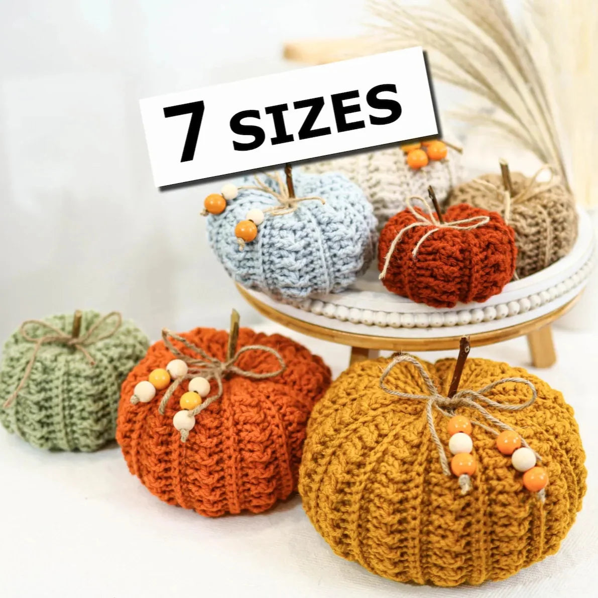 Crocheted fall pumpkins in warm autumn colors and several sizes