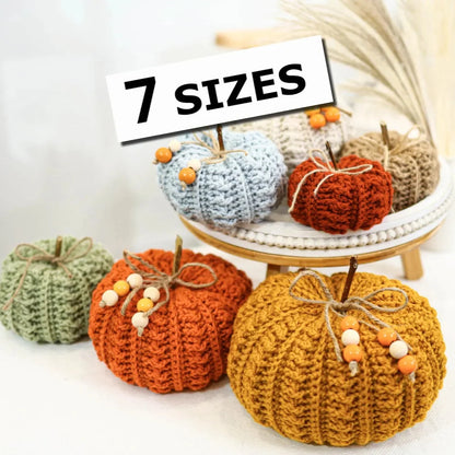 Crocheted fall pumpkins in warm autumn colors and several sizes