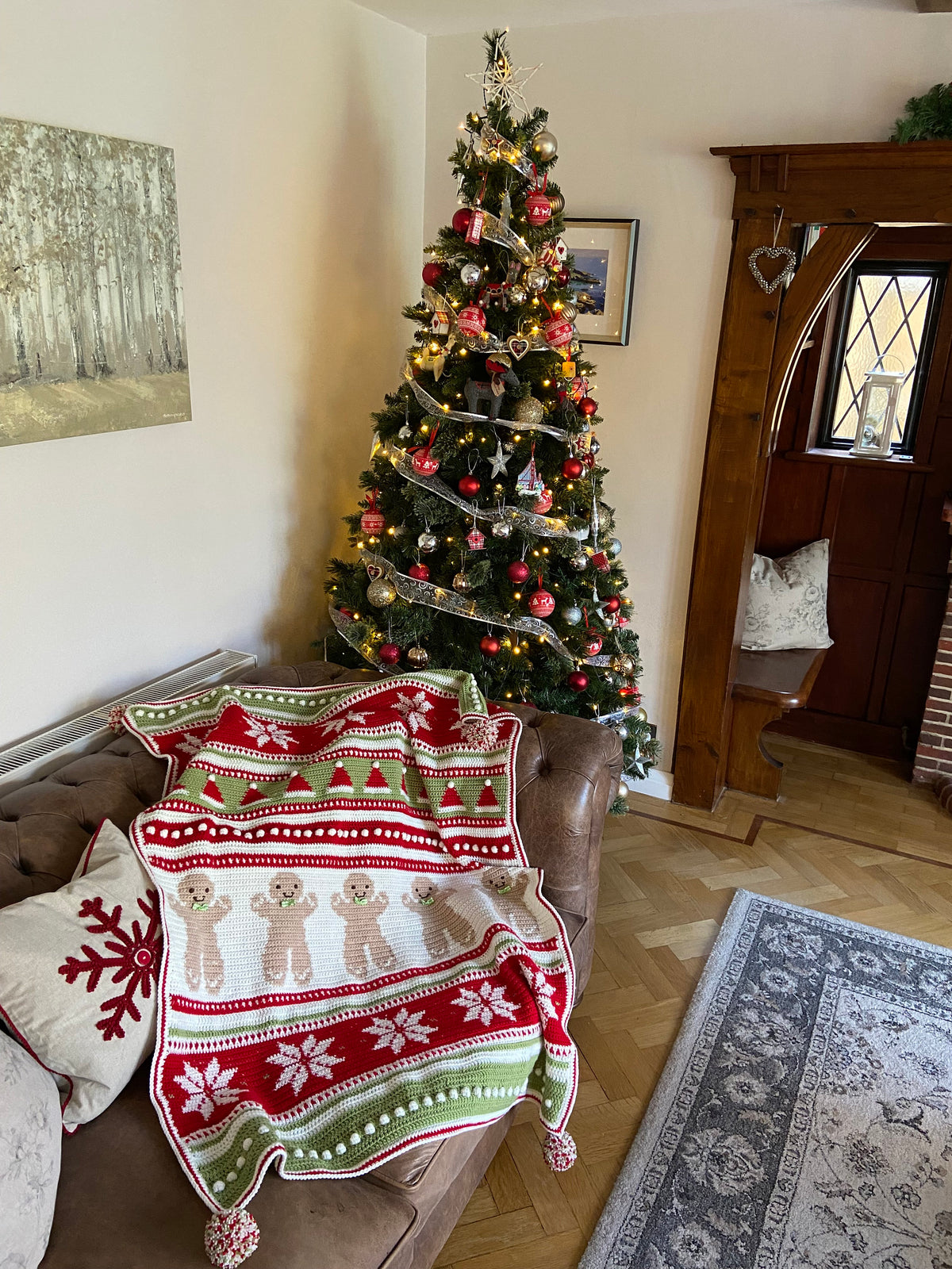 Christmas Eve Wishes crochet blanket draped over a sofa