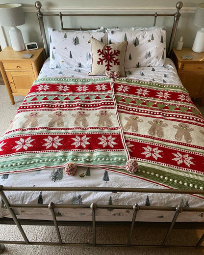 Christmas Eve Wishes blanket displayed at the foot of a bed