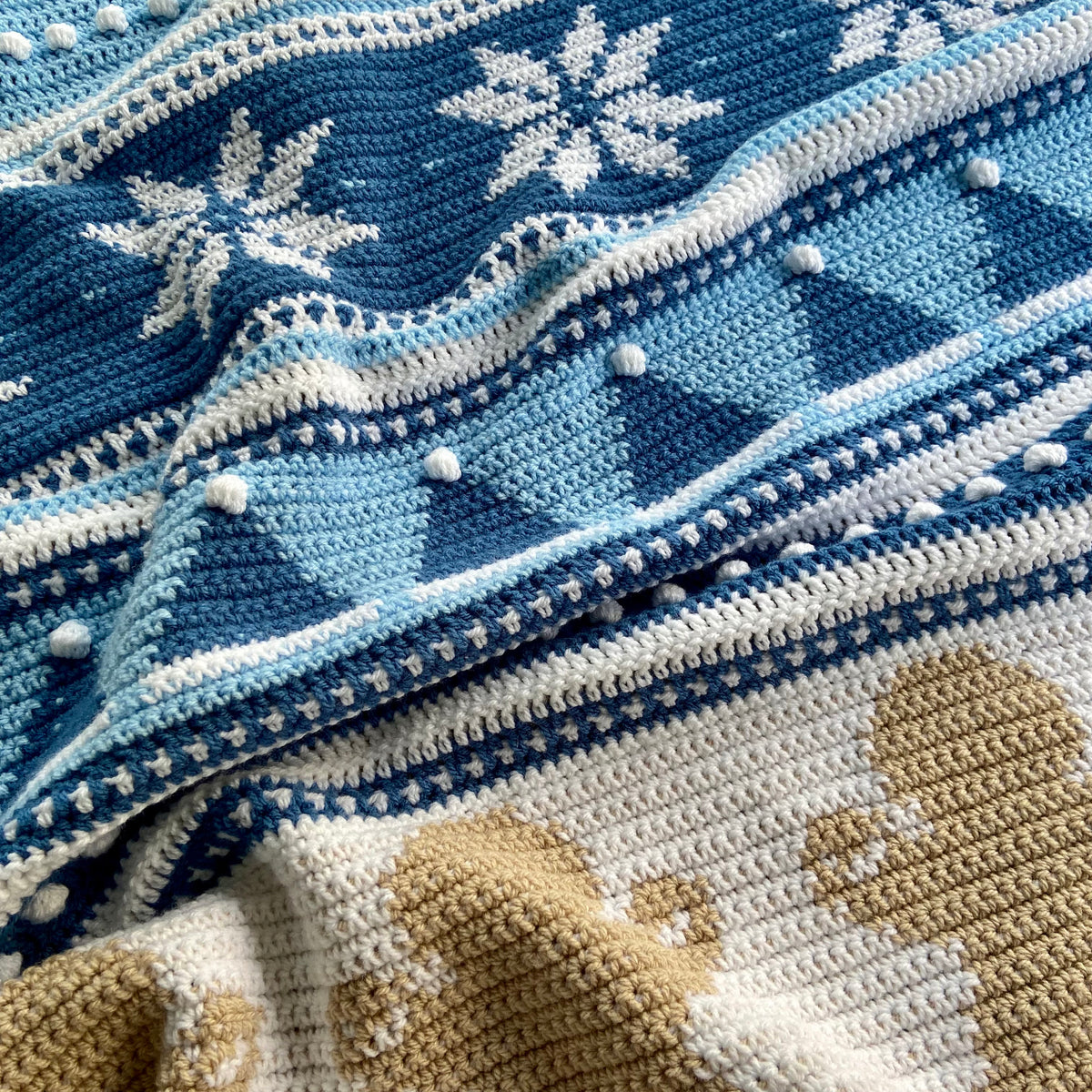 Blue and cream colorway with snowflake and gingerbread motifs