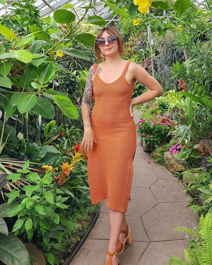 Fitted crochet Impact summer dress with leg slits worn by a model