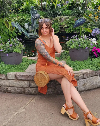 Detail of the overlapping cuffs on the dress leg slits