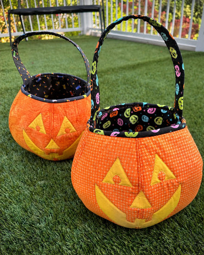 Two handmade Halloween jack-o'-lantern trick-or-treat tote bags, orange with black felt faces