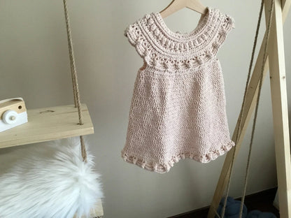 Crochet baby dress in a soft vintage color