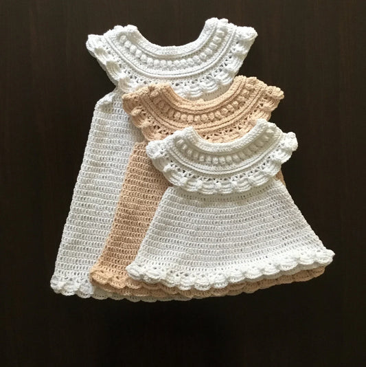 Crocheted vintage-style baby dress with delicate ruffles