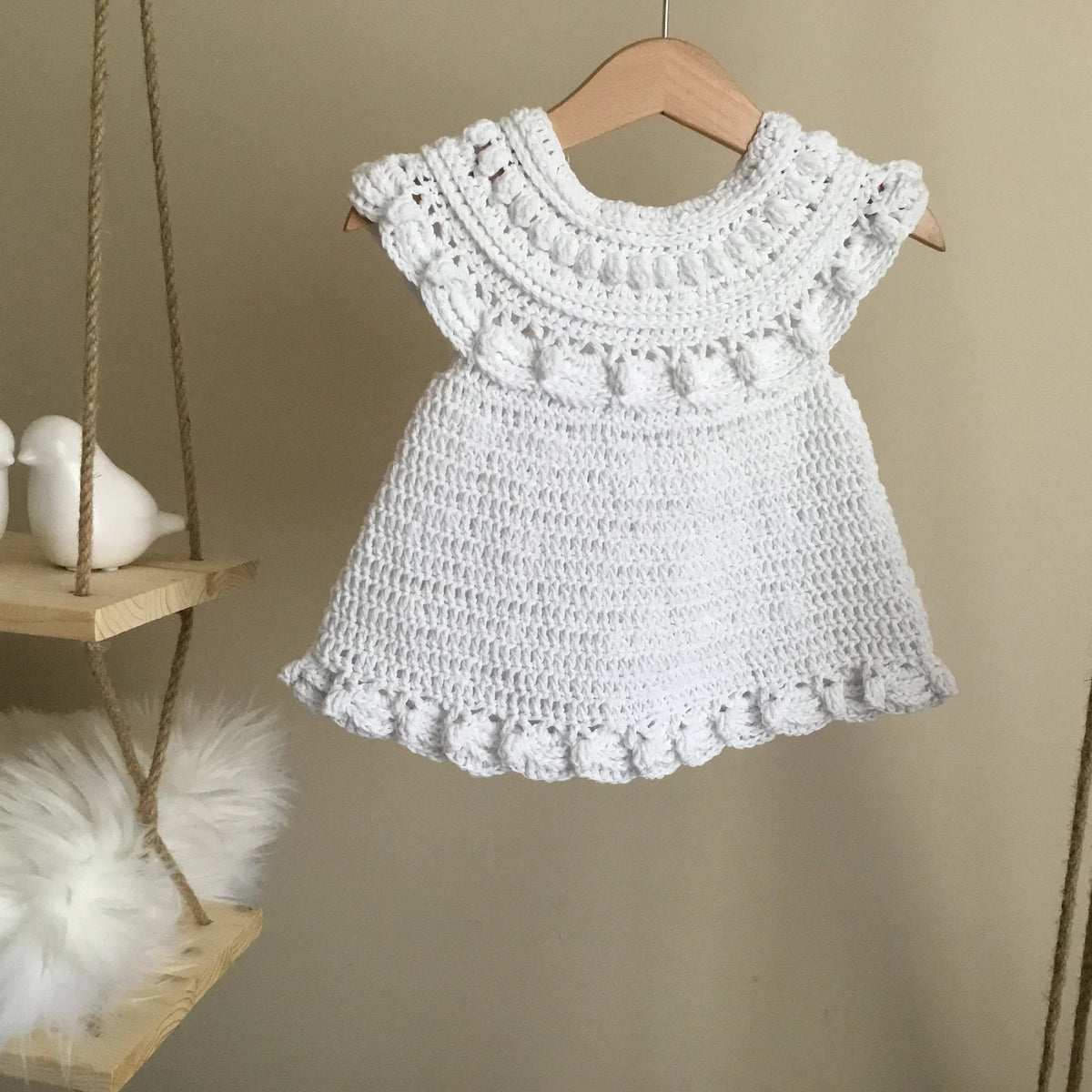 Back view of the crocheted Moonpetal baby dress