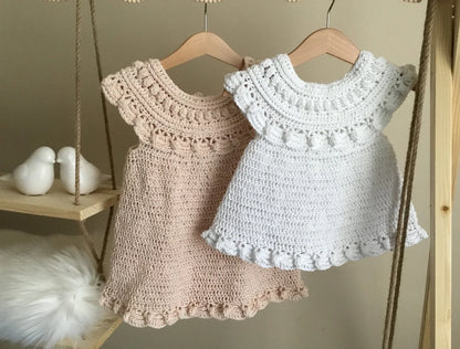 Baby wearing the Moonpetal ruffled crochet dress