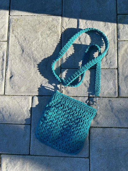 Inside of the crossbody bag with extra pocket for phone or keys