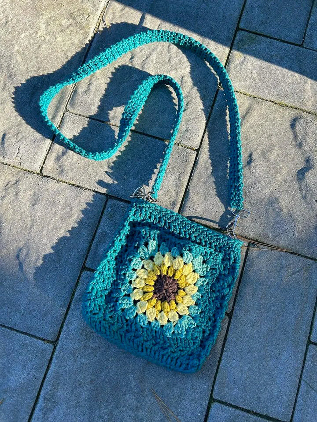 Sunflower crossbody bag showing the sturdy crochet strap