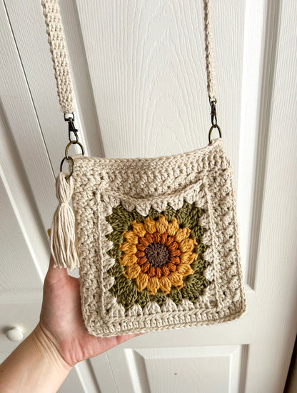 Sunflower granny square crossbody bag worn across the body