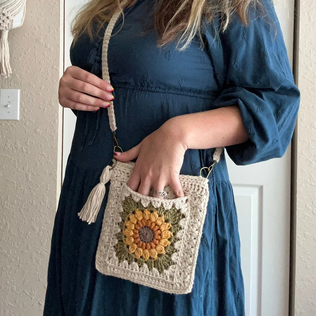 Crocheted sunflower granny square crossbody bag, front view