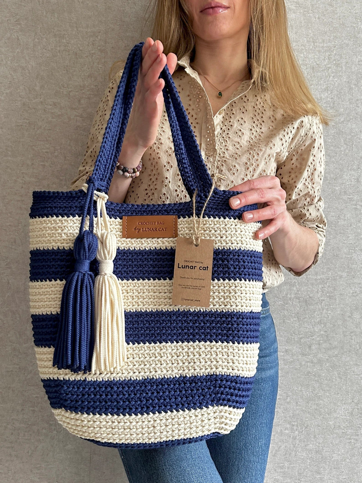 Crocheted Hampton tote bag with sturdy handles on a beach