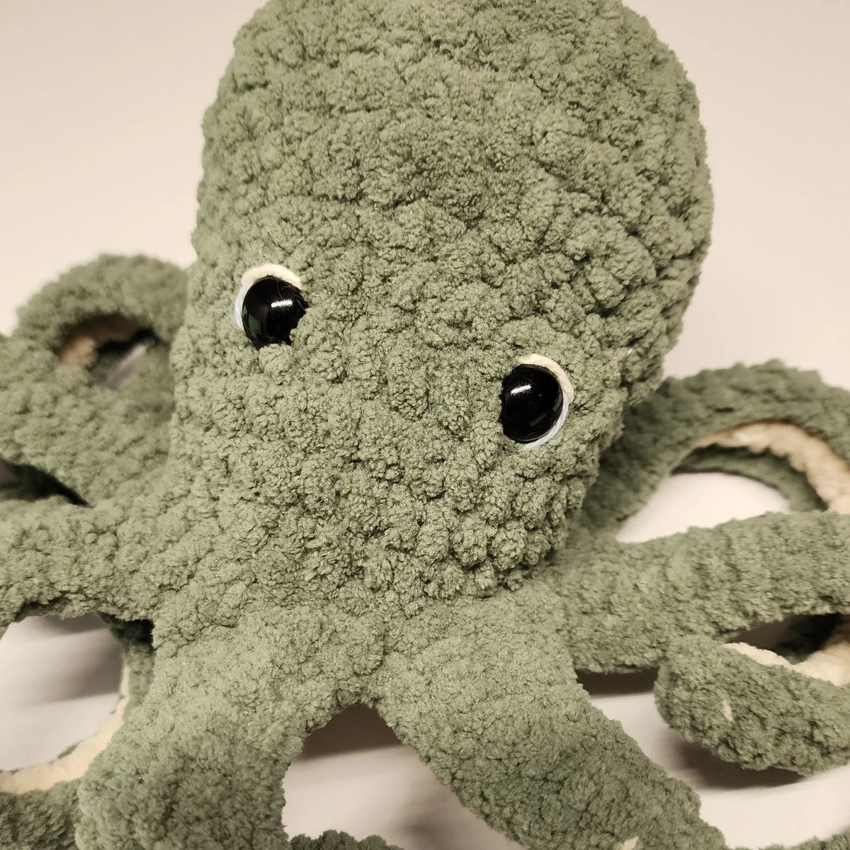 Crochet octopus in blue and orange yarn