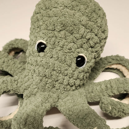 Crochet octopus in blue and orange yarn