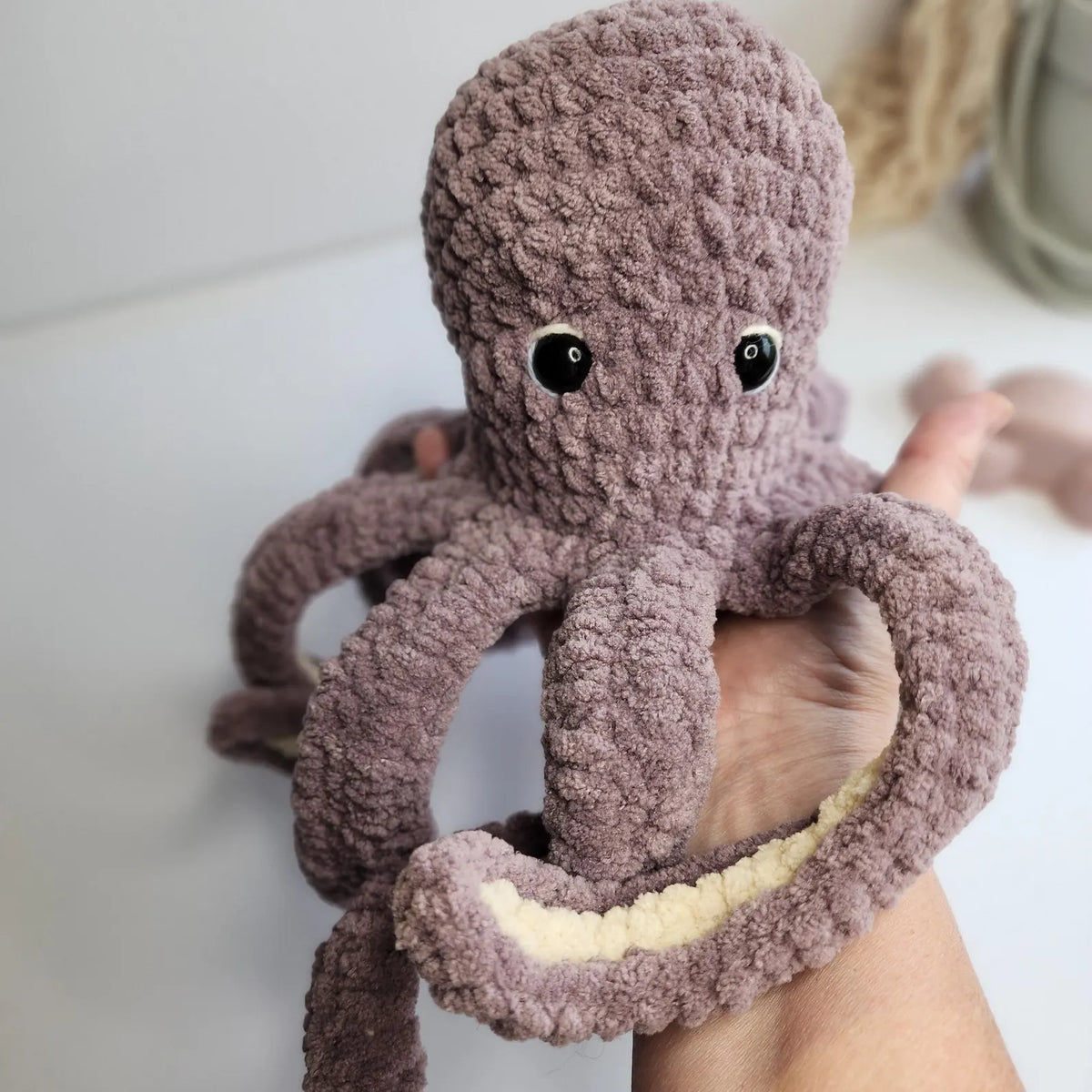 Crocheted octopuses in several different colors