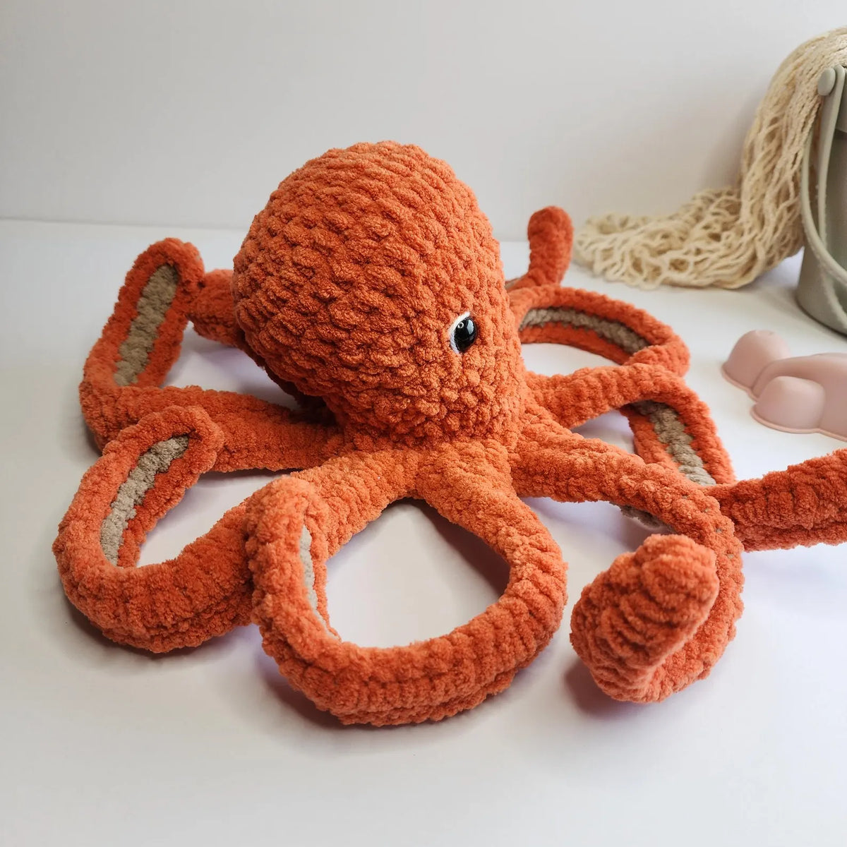 Close-up of a crocheted octopus face