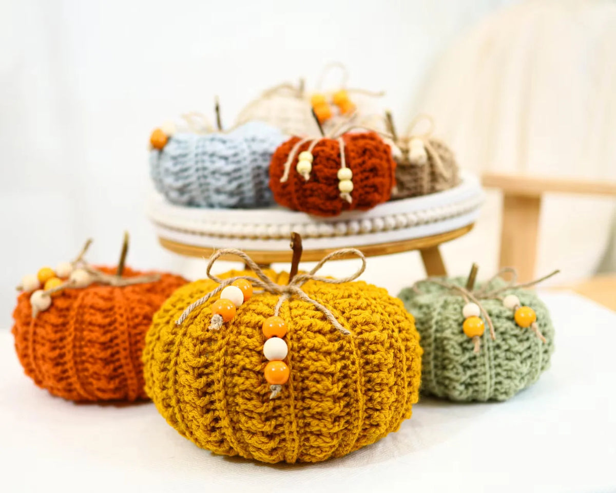 Crochet pumpkins in different sizes and warm fall shades