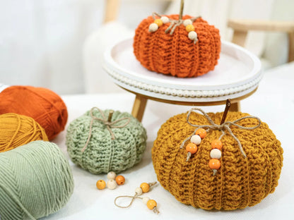 Set of textured crochet pumpkins arranged as fall decor