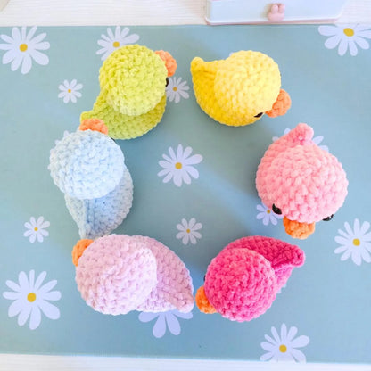 Crochet duck family displayed as nursery decor