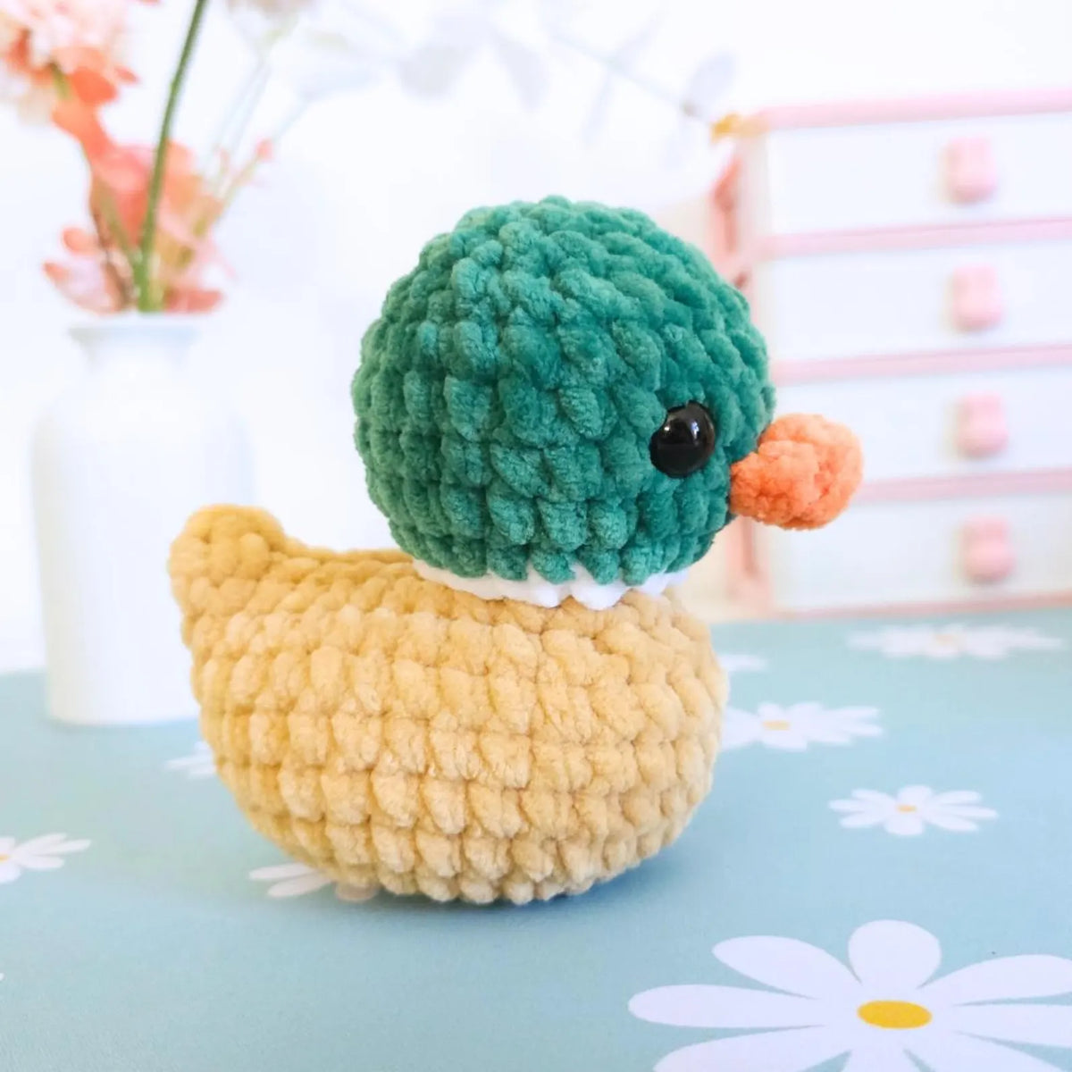 Crochet rubber ducks in an Easter basket arrangement