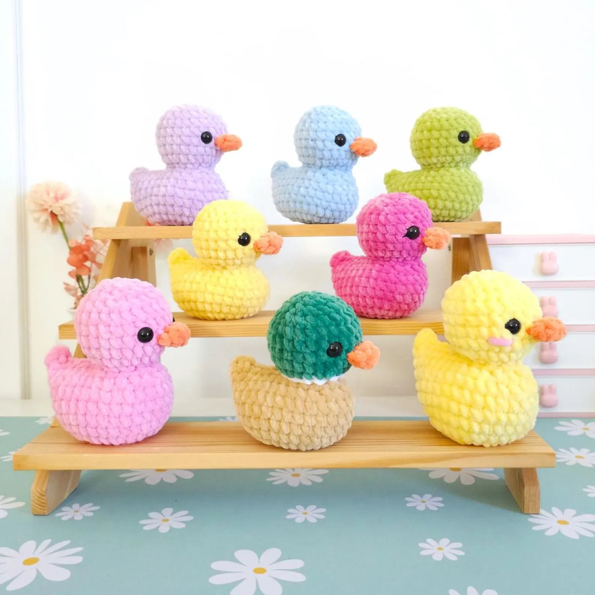 Collection of no-sew crochet ducks in mixed colors