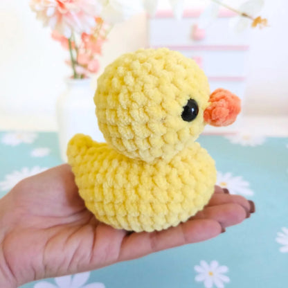 Pink and purple amigurumi rubber ducks