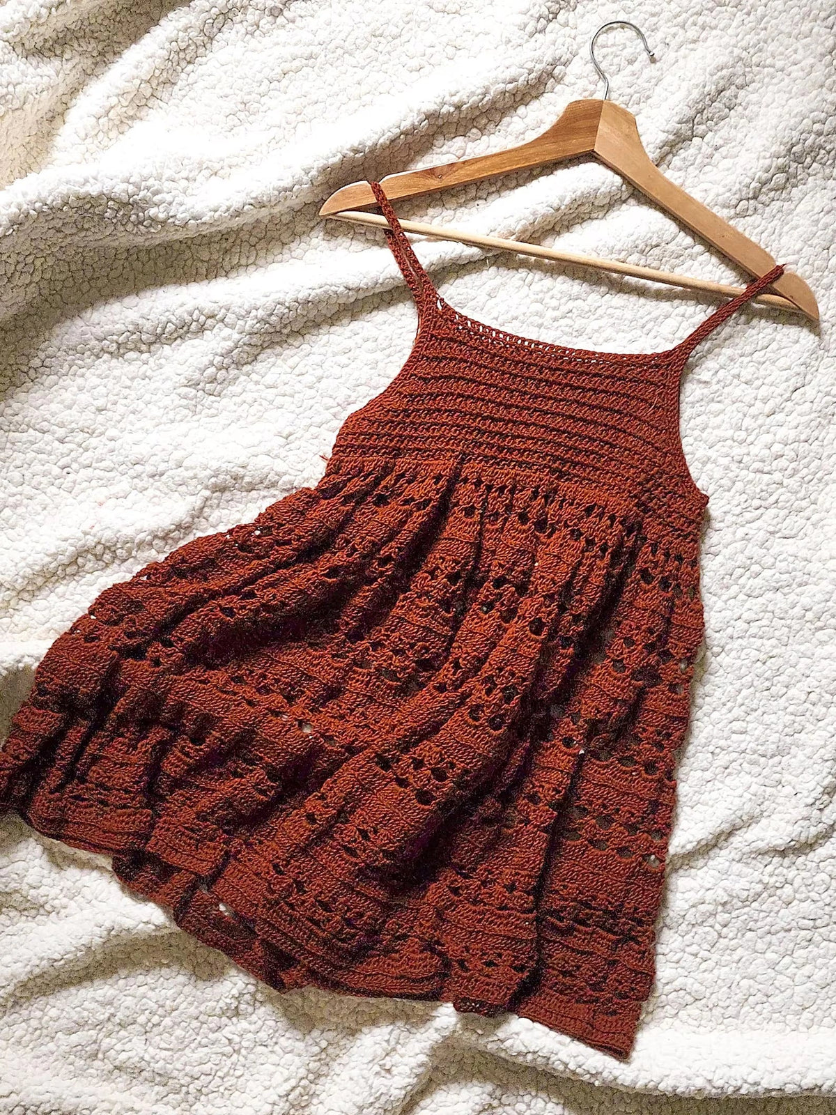 Detail of the decorative crochet texture on the babydoll dress